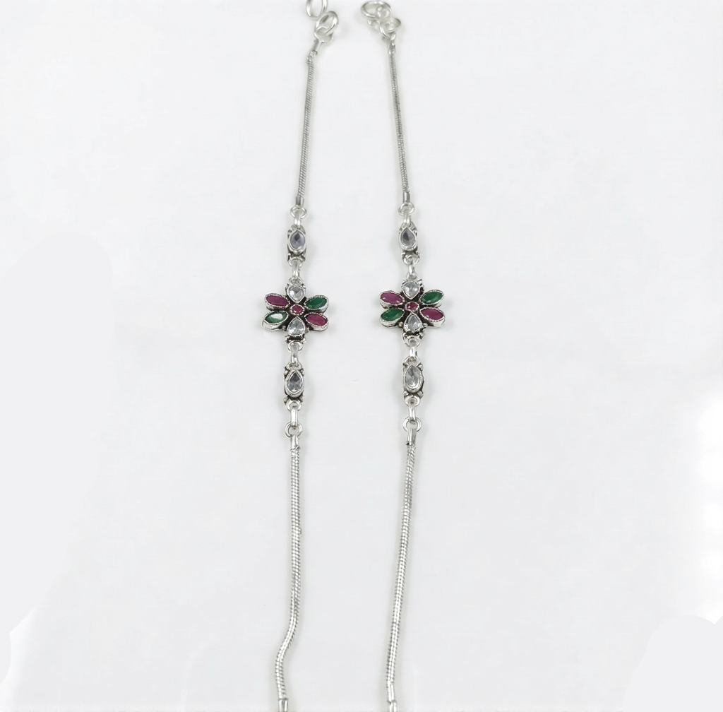 Silver necklace with floral pendants on a white background