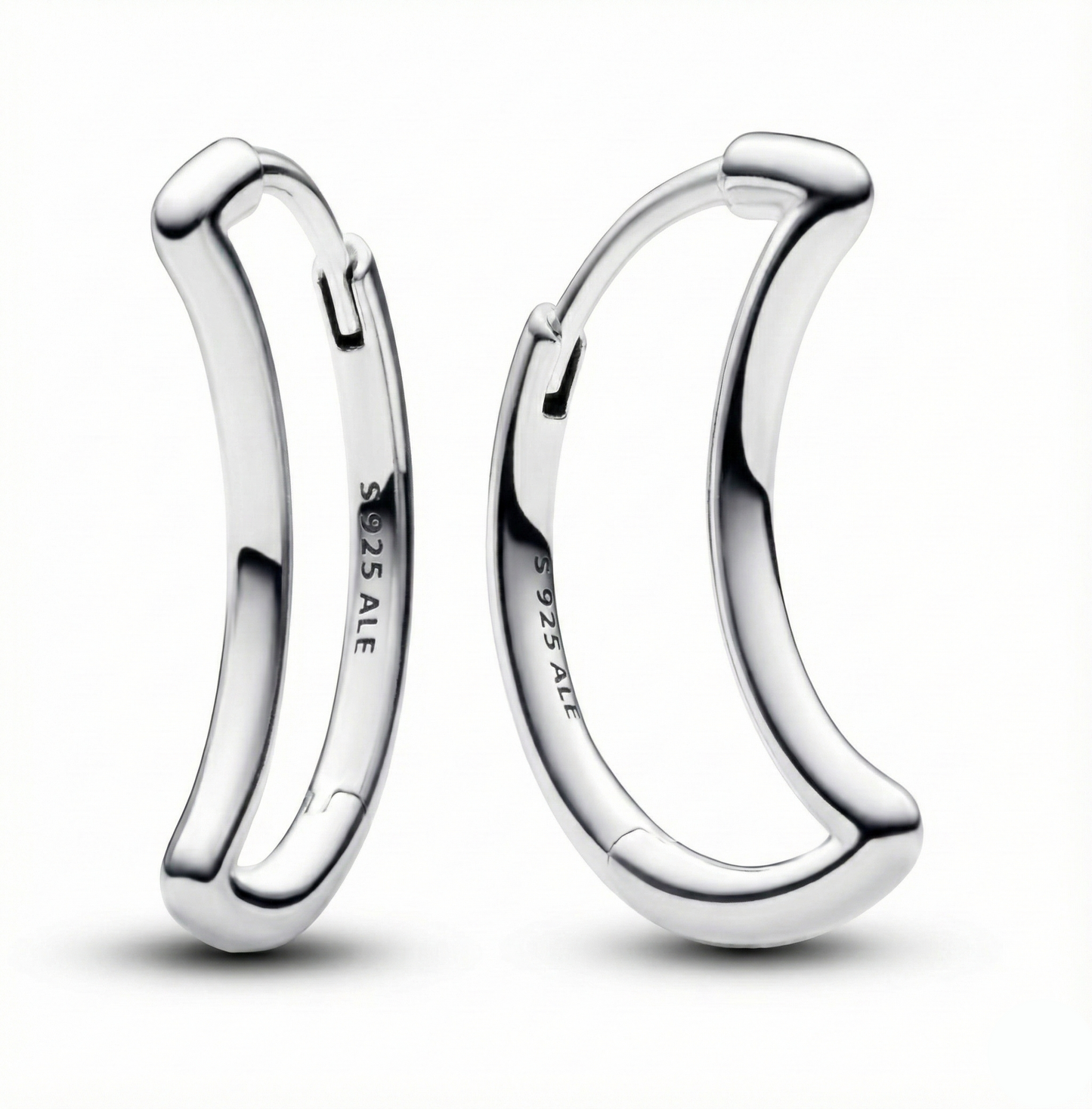 Pair of silver hoop earrings on a white background