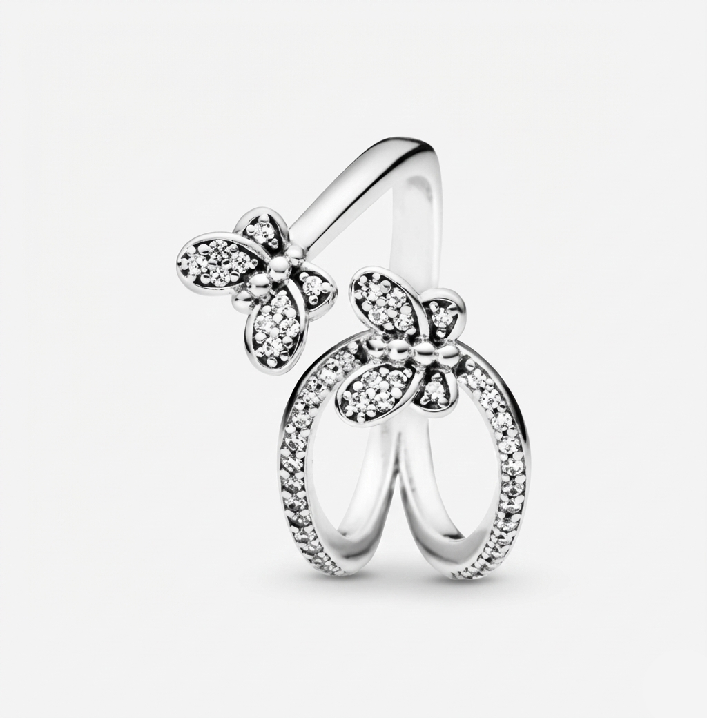 Silver butterfly ring with clear gemstones on a light gray background