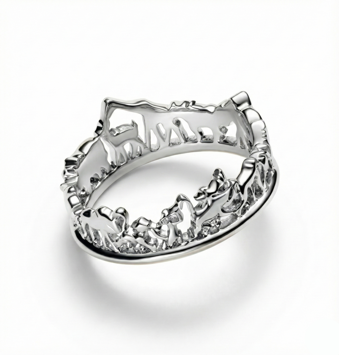 Silver ring with intricate design on a white background