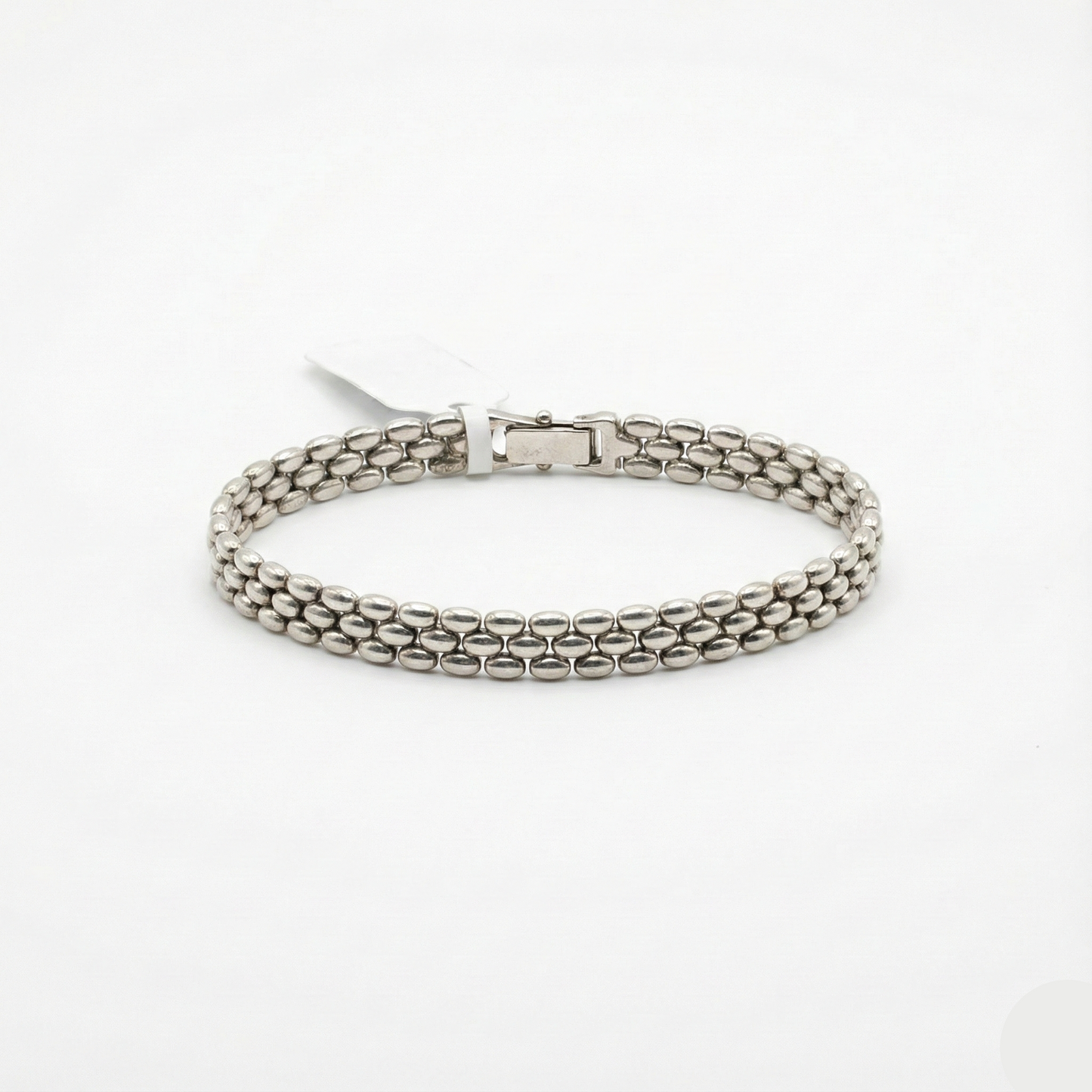 Silver chain bracelet on a white background