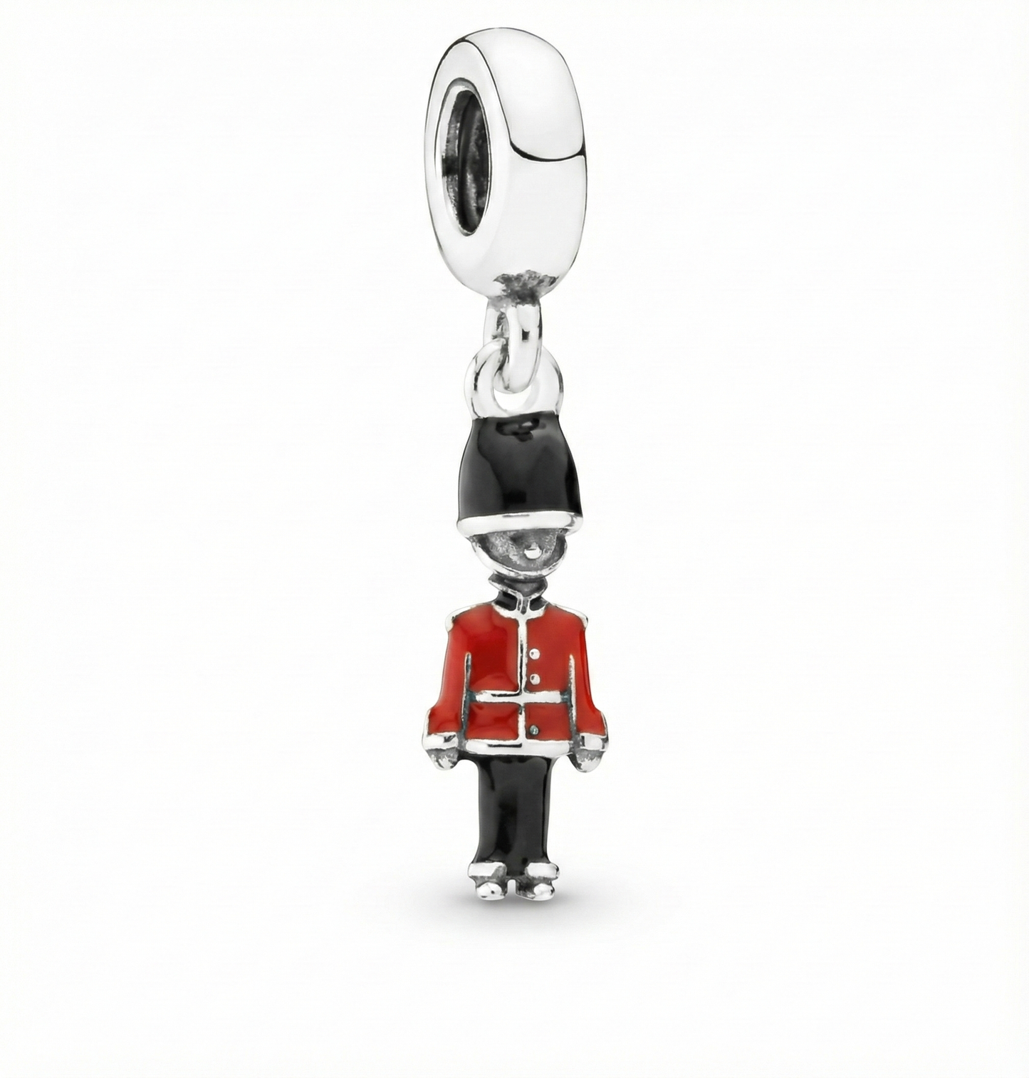 Charm resembling a guard in a red uniform on a white background