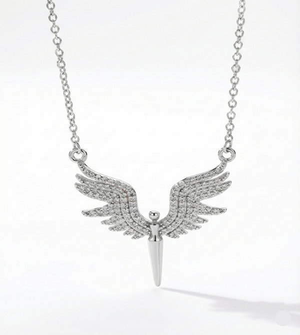 Silver necklace with winged pendant on a white background
