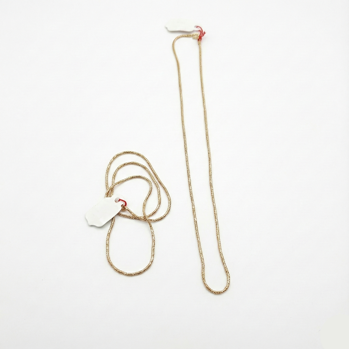 Gold chain necklace on a white background