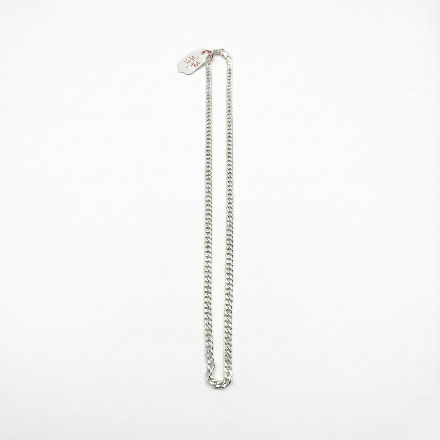 Silver chain necklace on a white background