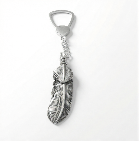 Silver feather-shaped bottle opener on a white background