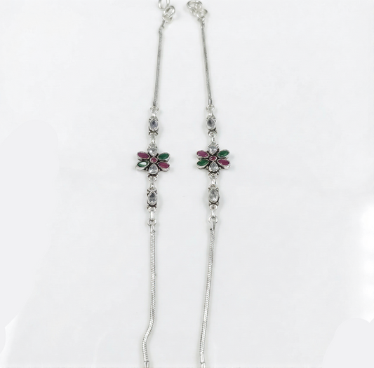 Silver necklace with floral pendants on a white background