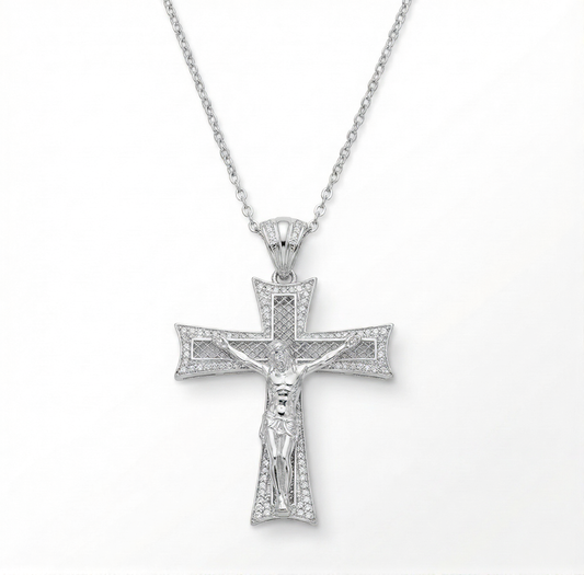 Silver cross pendant necklace on a white background
