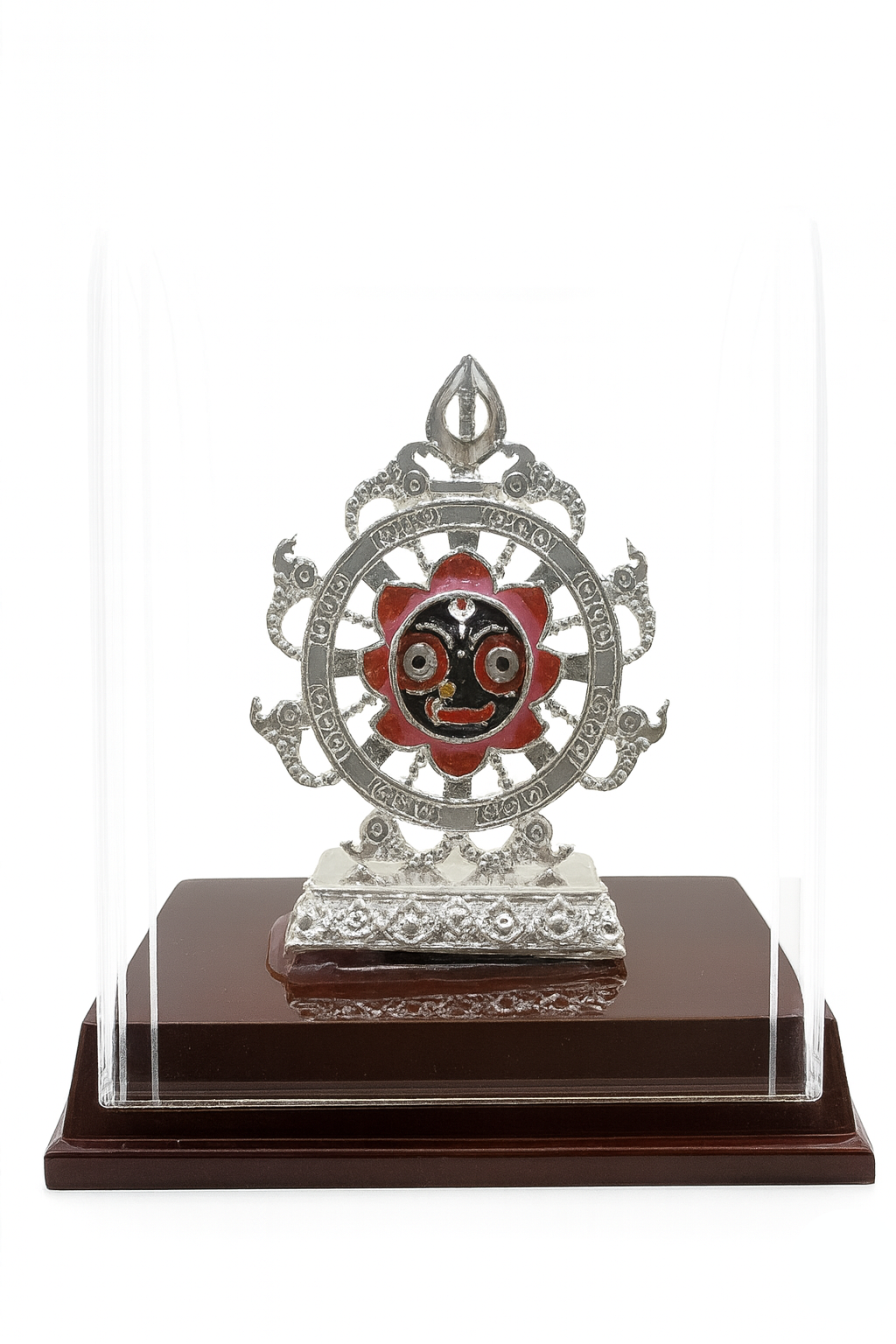Decorative metal emblem with red center on a wooden base against a white background