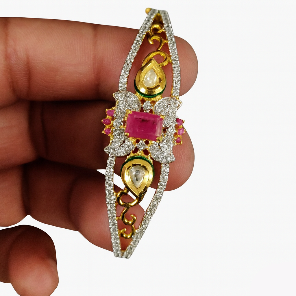 Gold and diamond earring held between fingers against a white background