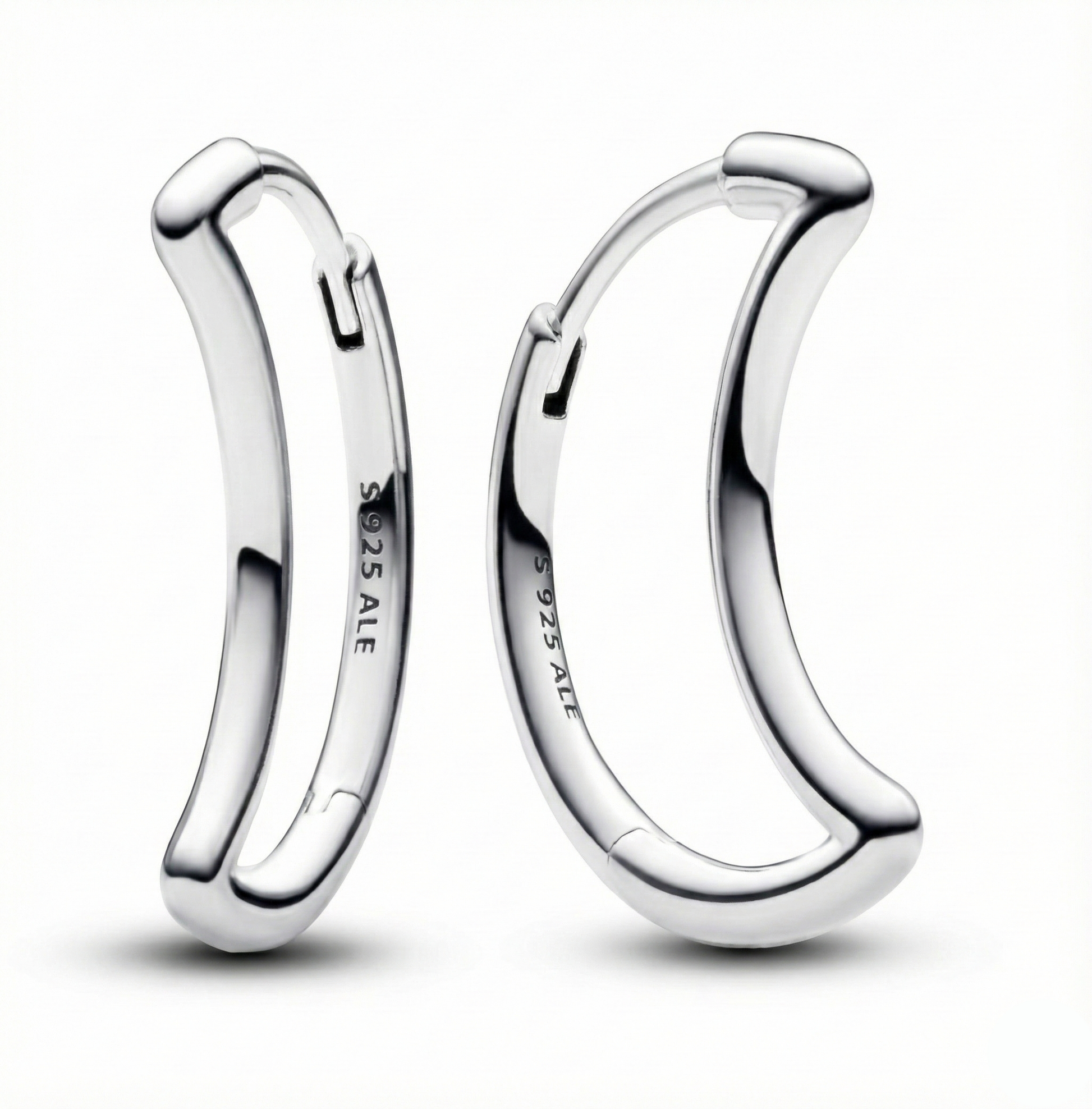 Pair of silver hoop earrings on a white background