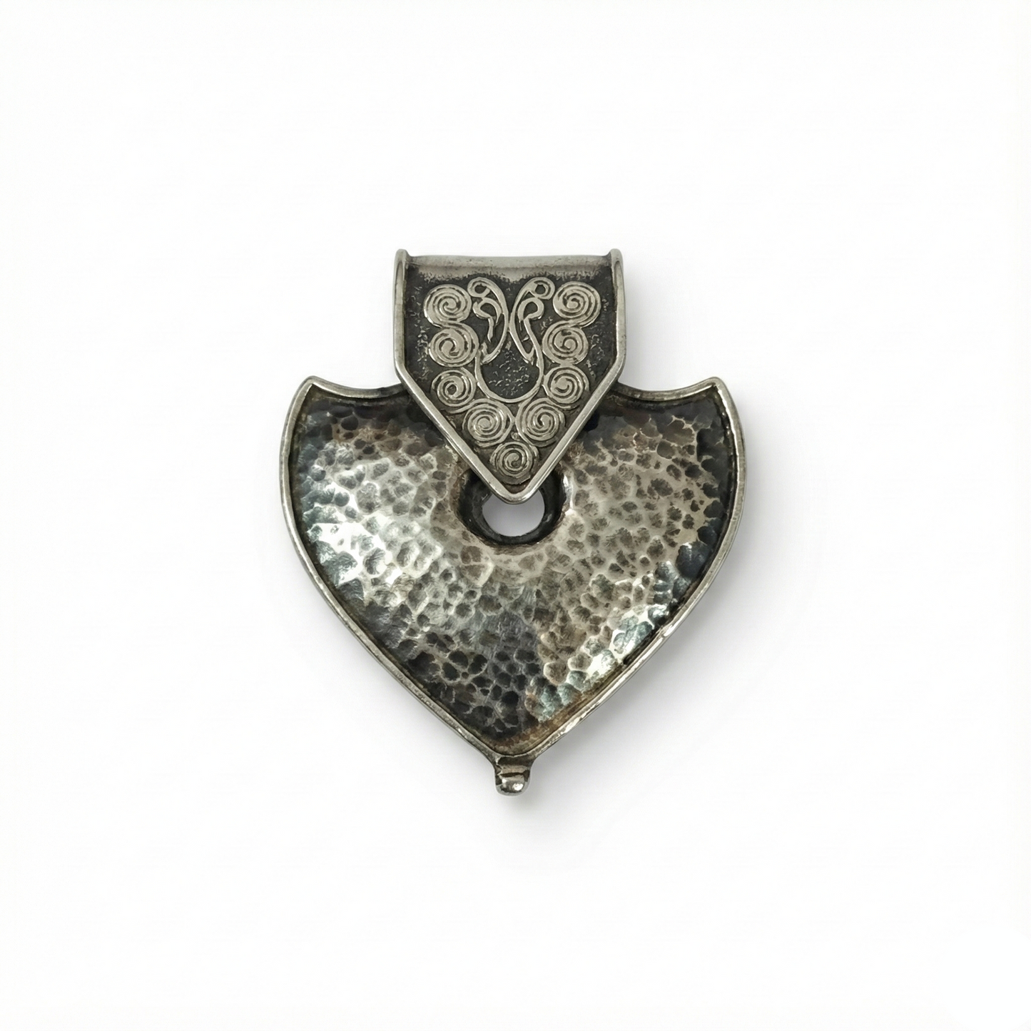 Silver pendant with a textured design on a white background