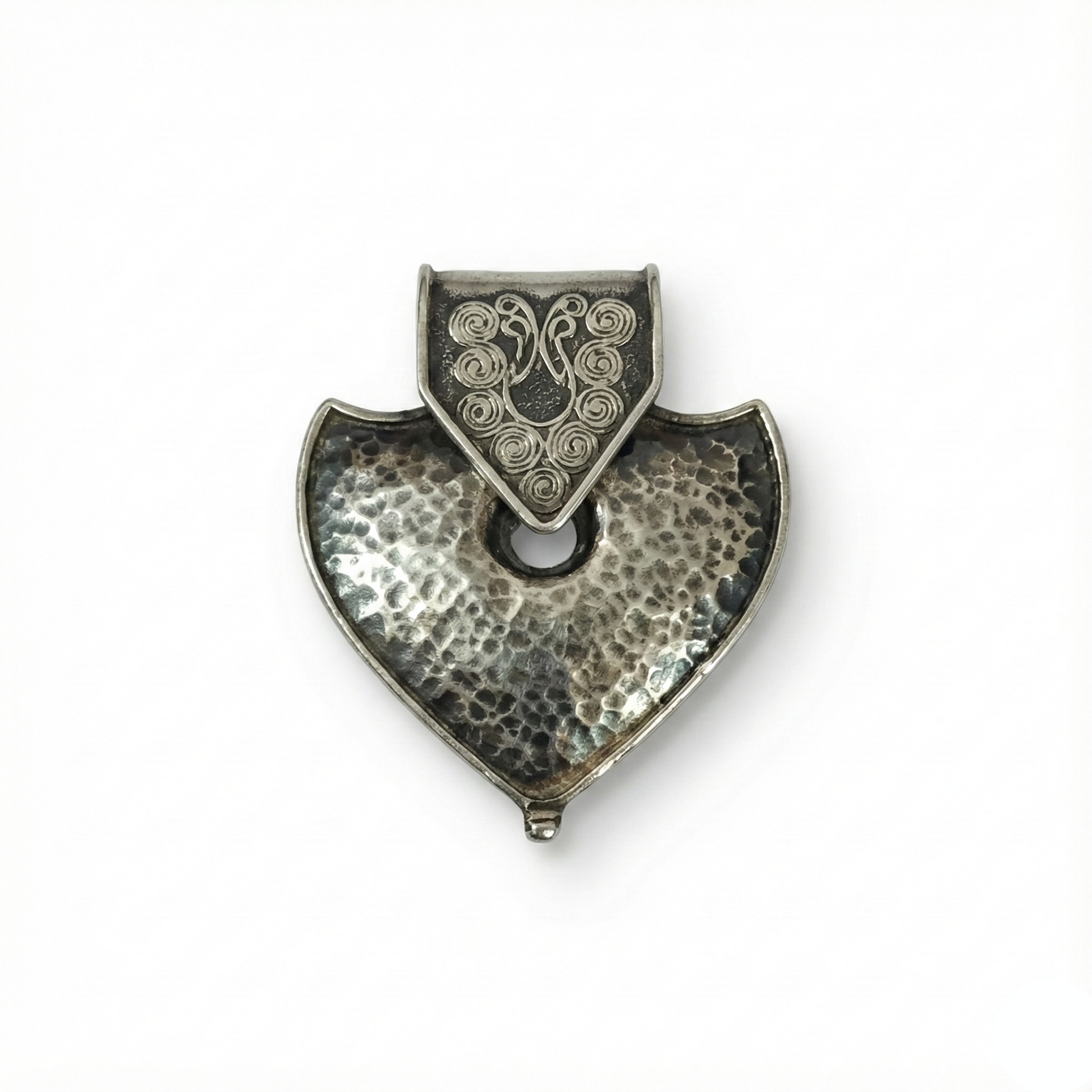 Silver pendant with a textured design on a white background