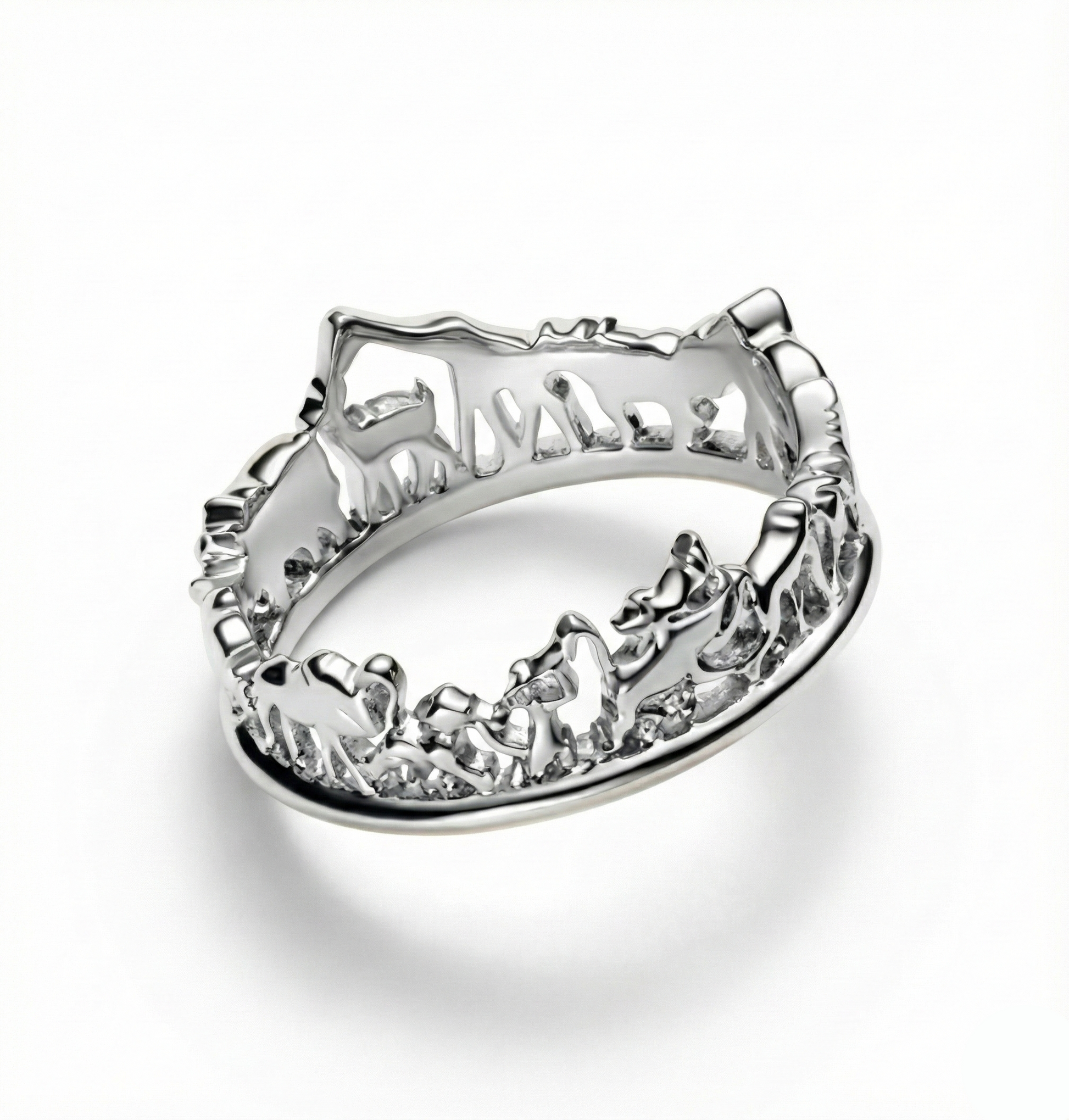 Silver ring with intricate design on a white background