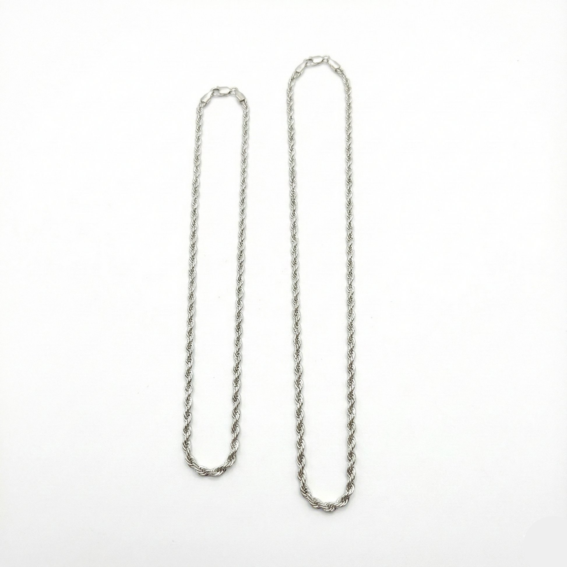 Silver chain necklace on a white background