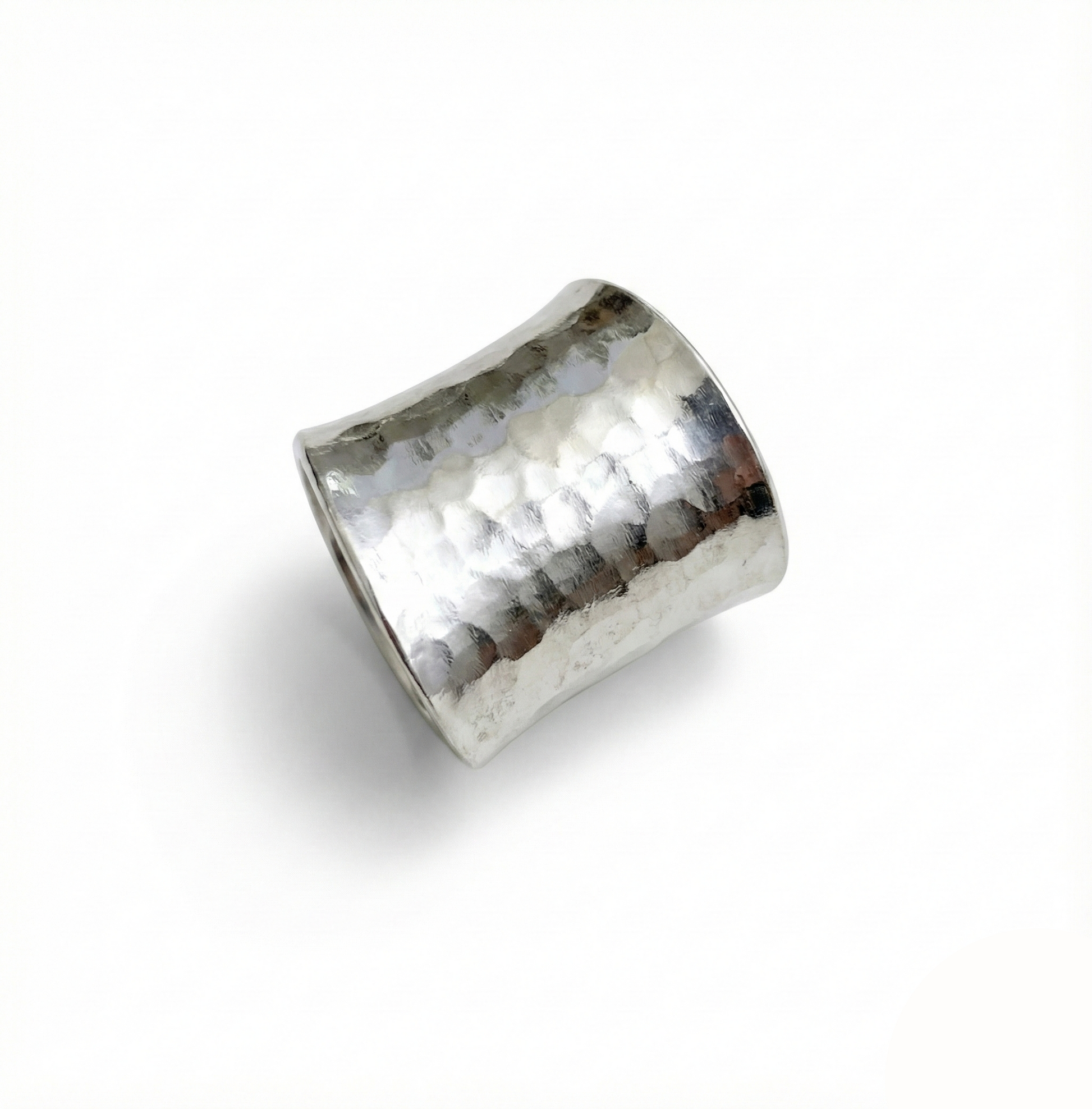Silver ring with a textured surface on a white background