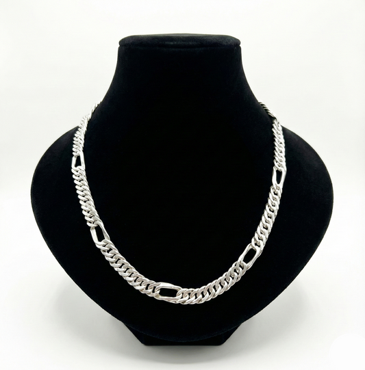 Silver chain necklace on a black bust
