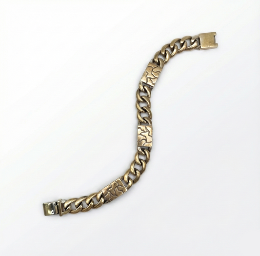 Gold chain bracelet on a white background