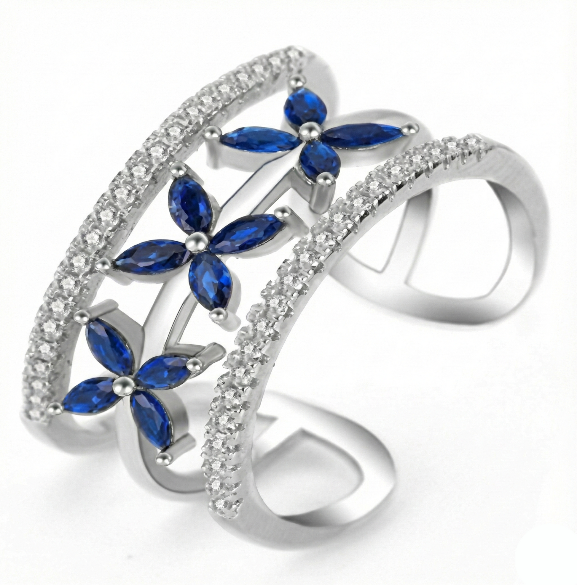 Silver ring with blue gemstones on a white background
