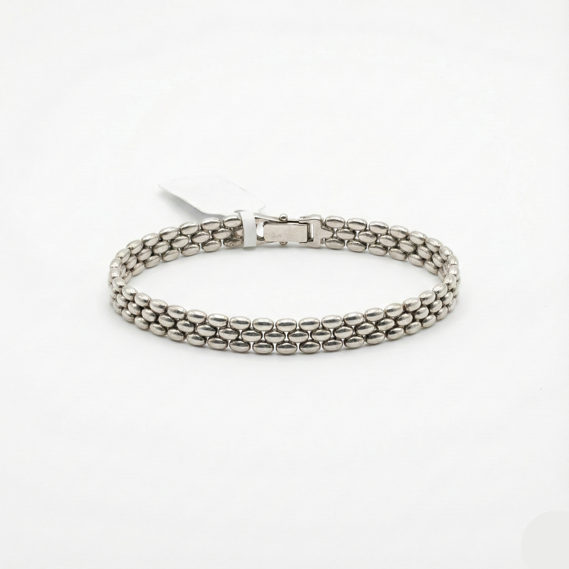 Silver chain bracelet on a white background