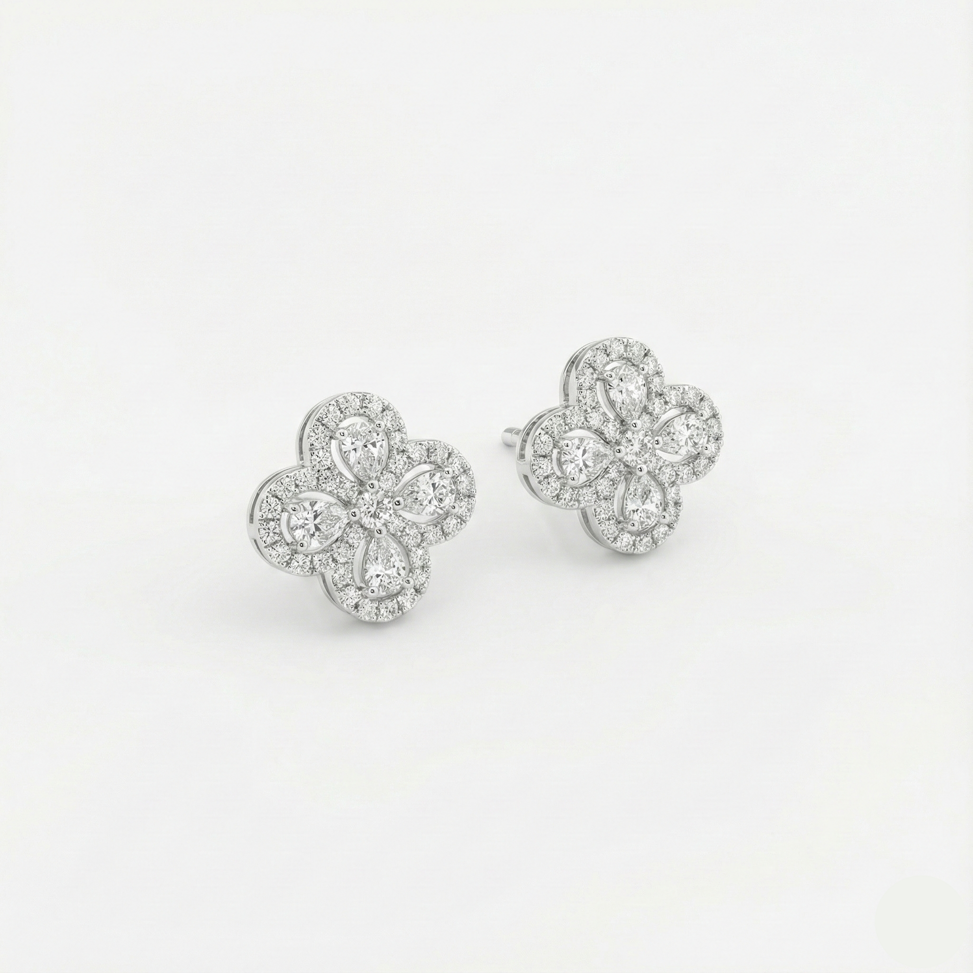 Pair of diamond earrings on a light gray background