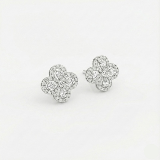 Pair of diamond earrings on a light gray background