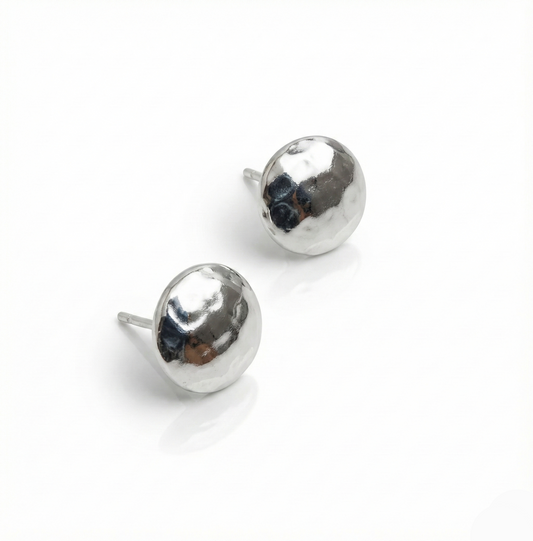 Pair of silver round earrings on a white background