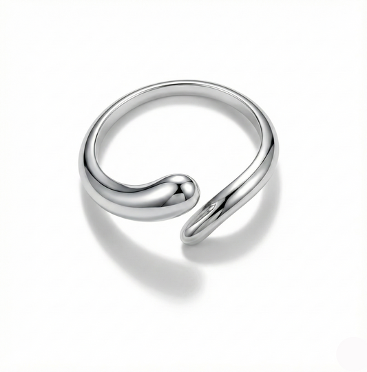 Silver spiral ring on a white background