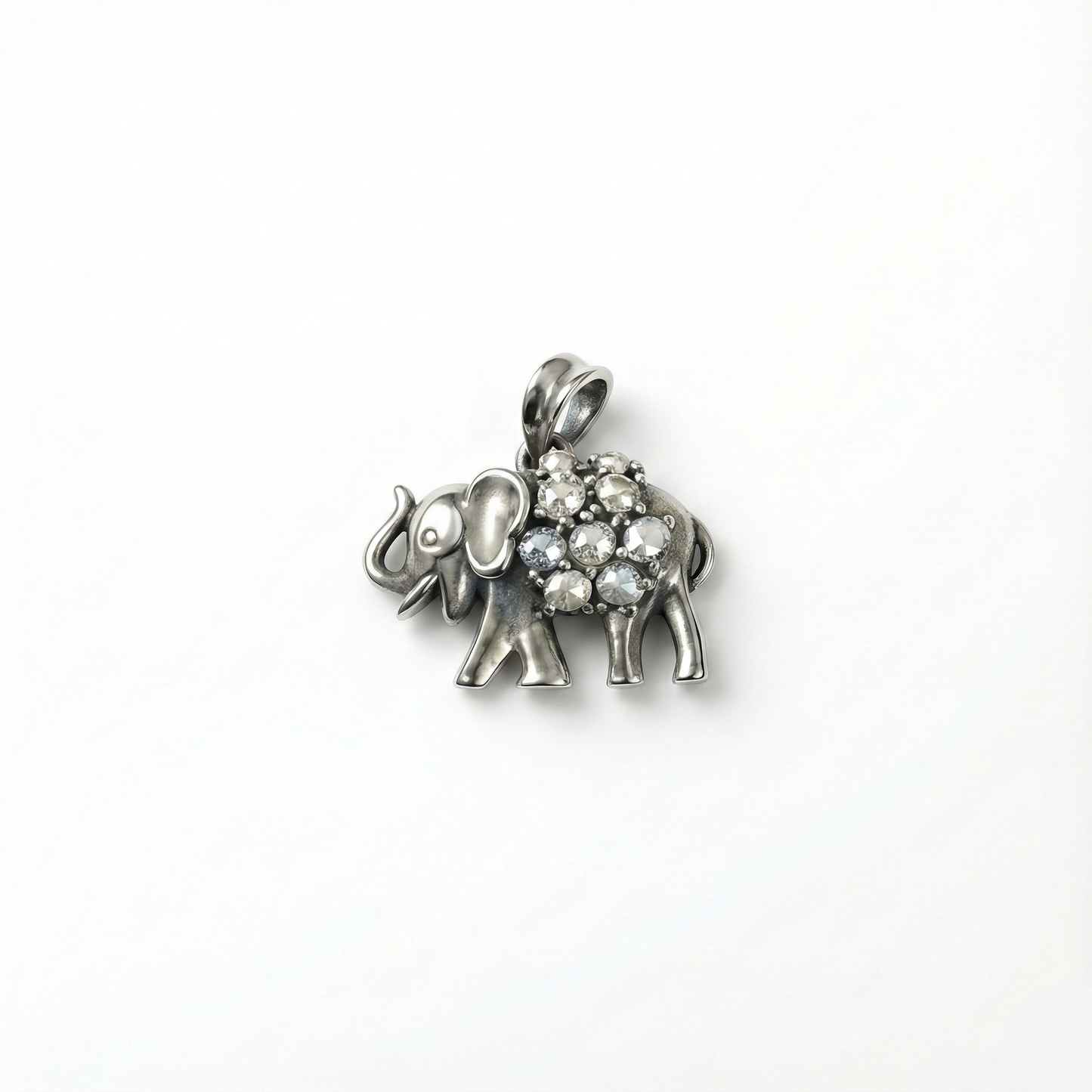 Silver elephant pendant with gemstones on a white background