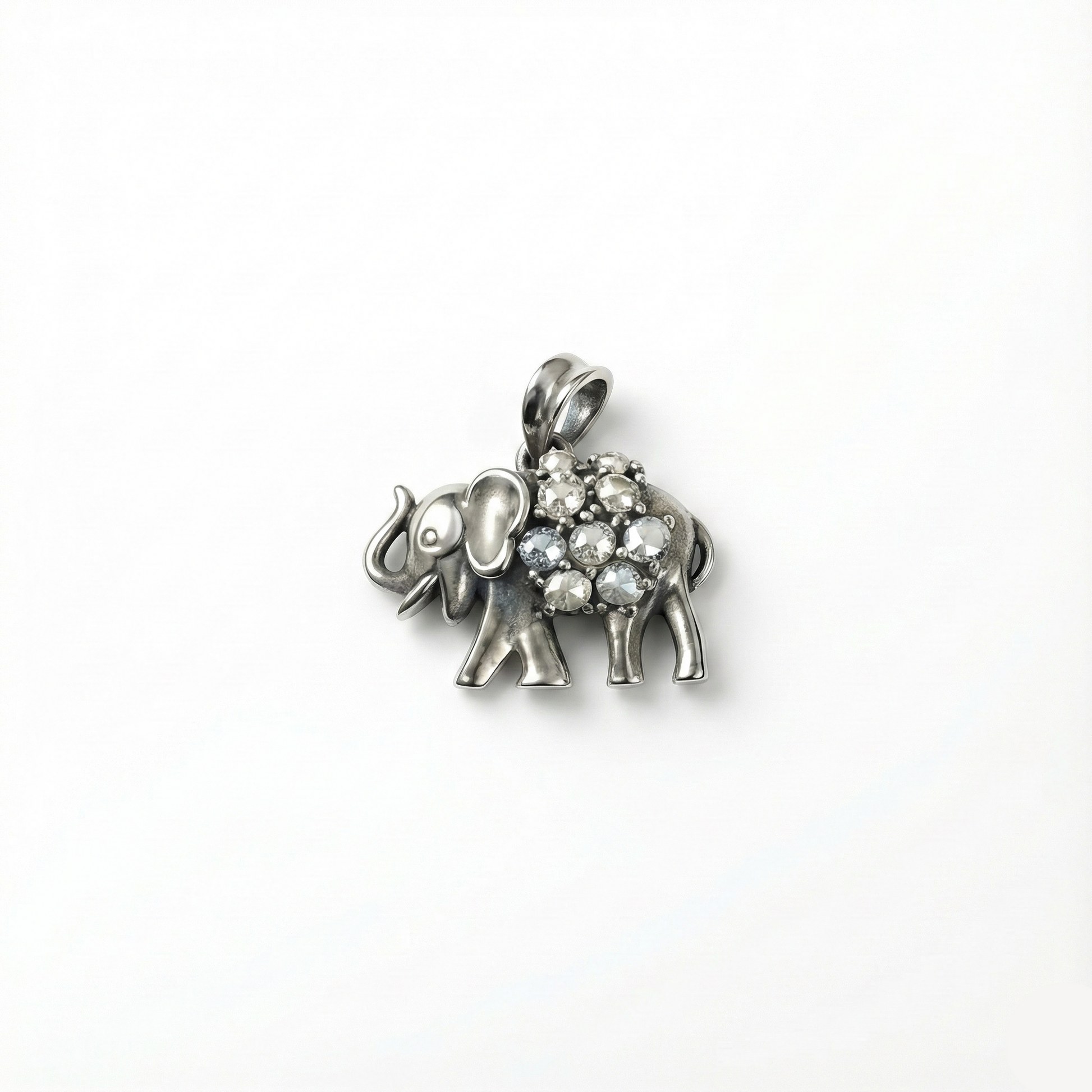 Silver elephant pendant with gemstones on a white background