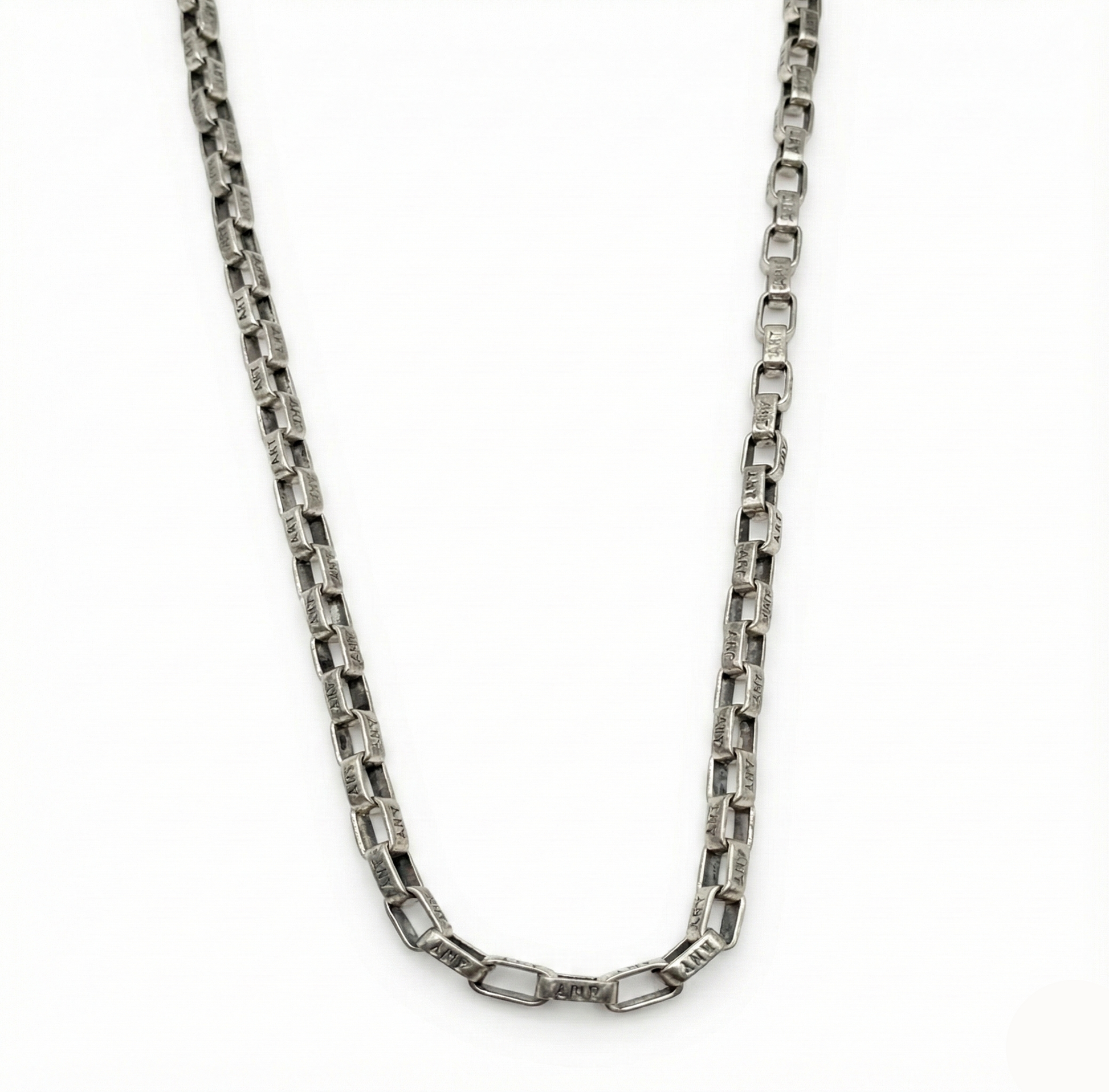 Silver chain necklace on a white background