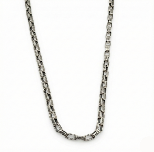 Silver chain necklace on a white background