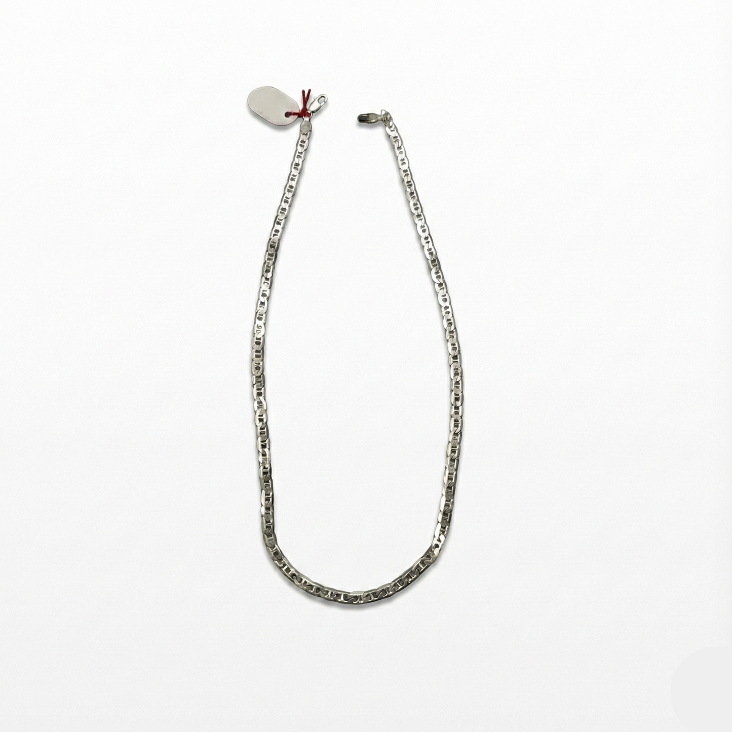 Silver chain necklace on a white background