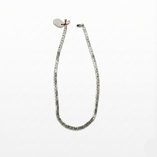 Silver chain necklace on a white background