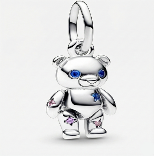 Silver teddy bear charm with colorful stones on a white background