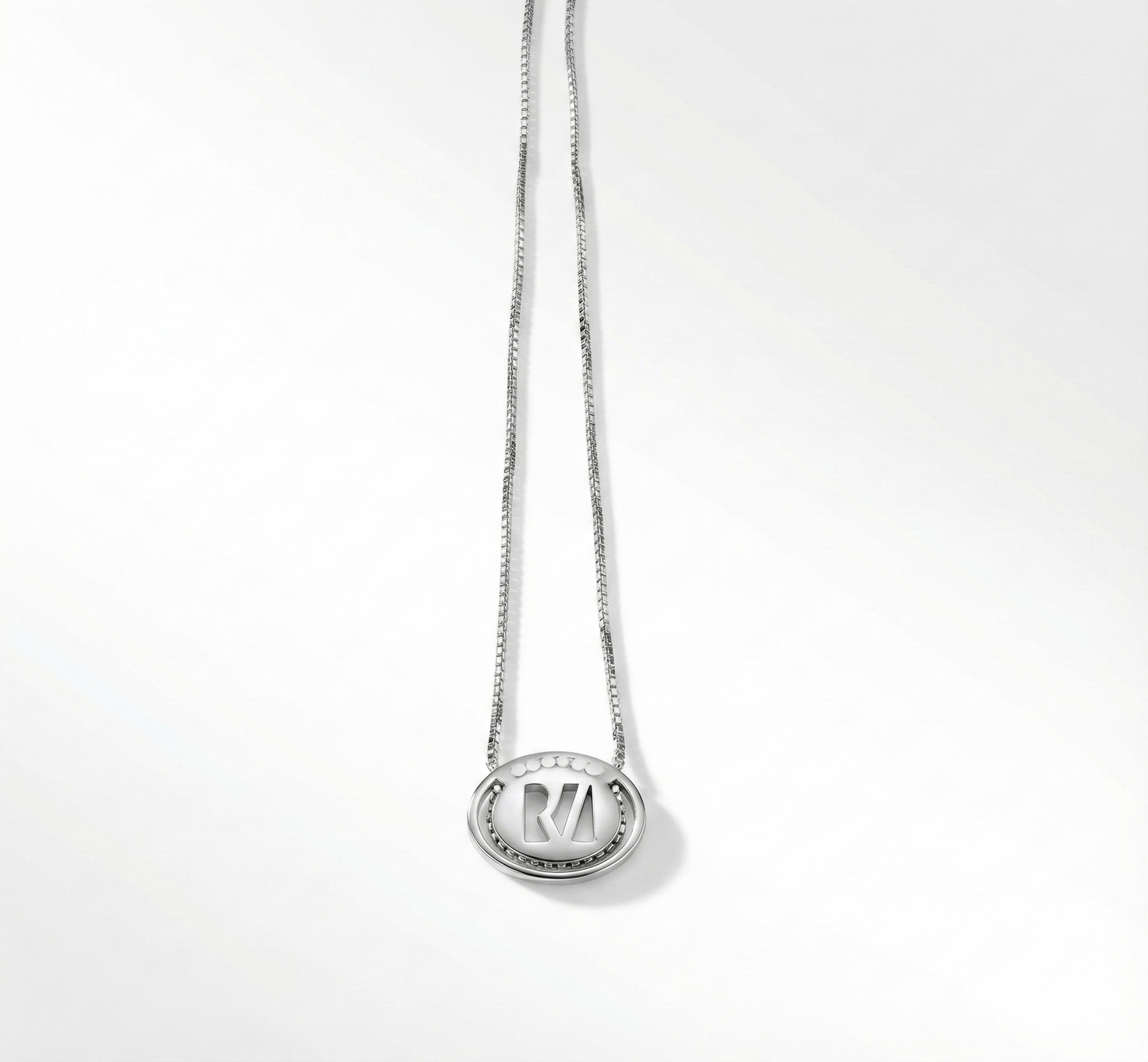Silver necklace with a pendant on a white background