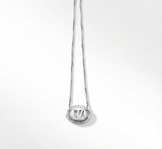 Silver necklace with a pendant on a white background