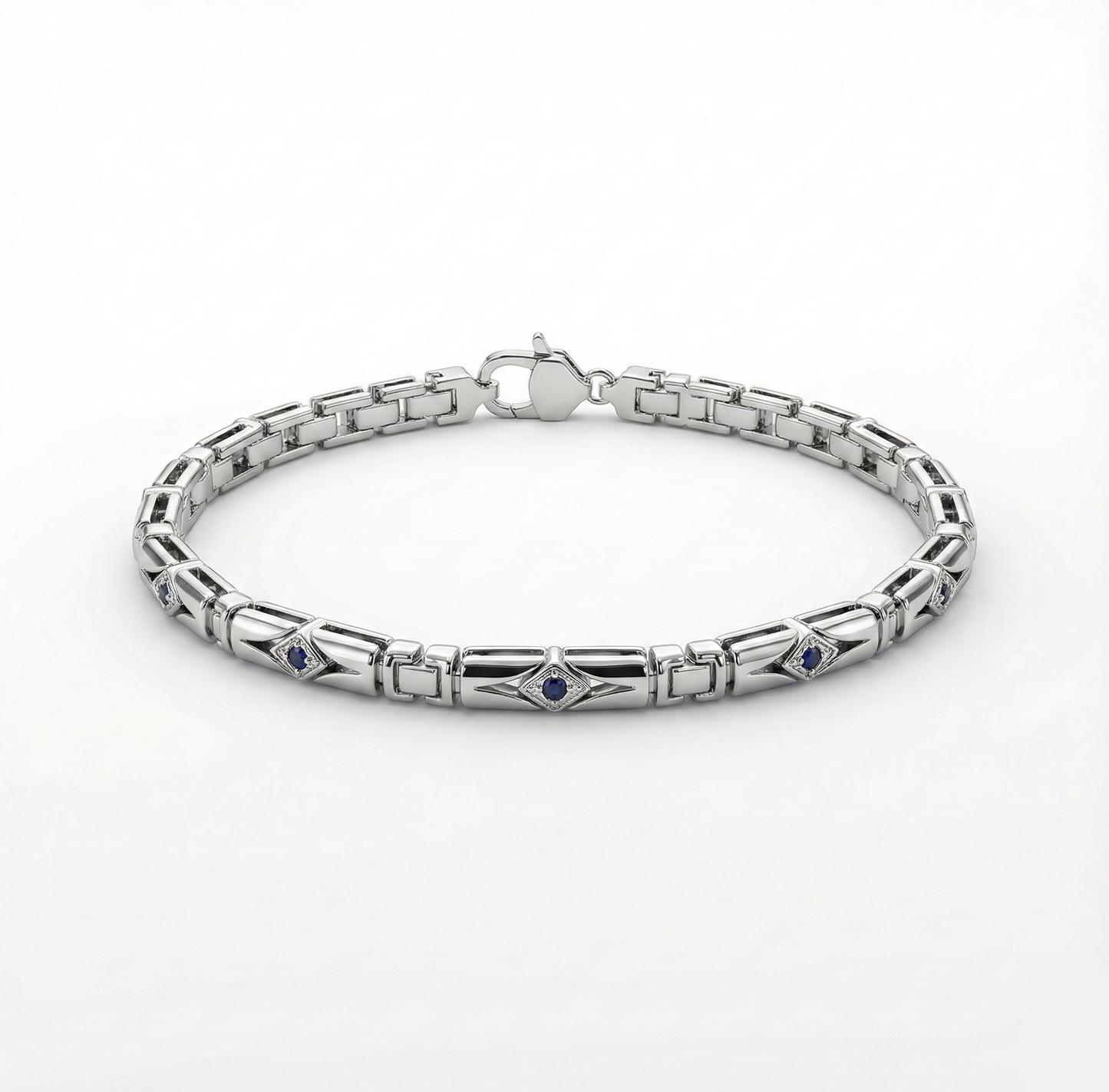 Silver bracelet with embedded stones on a white background
