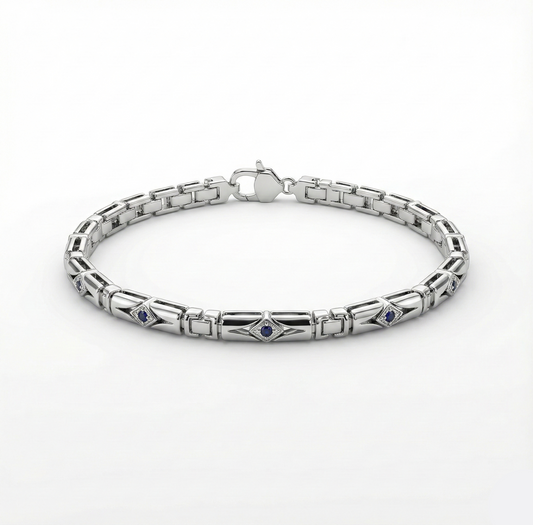 Silver bracelet with embedded stones on a white background