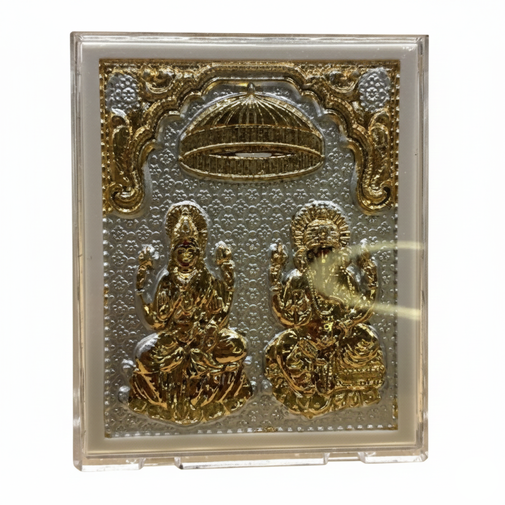 Decorative plaque with gold figures and intricate designs on a white background