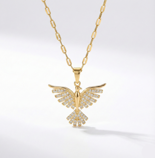 Gold necklace with a butterfly pendant on a white background