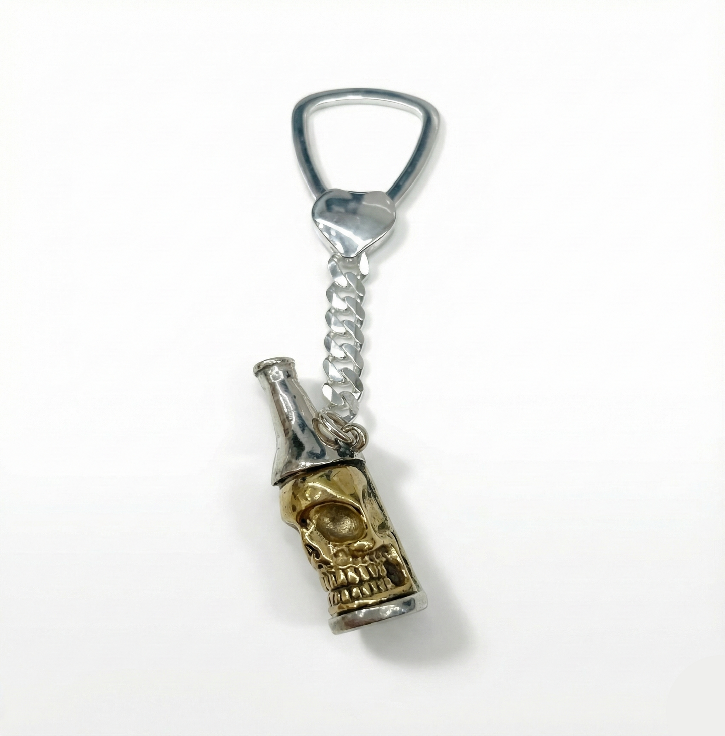 Bottle opener keychain with skull design on a white background