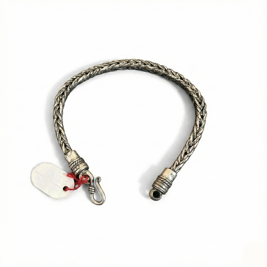 Silver braided bracelet with a lobster clasp on a white background