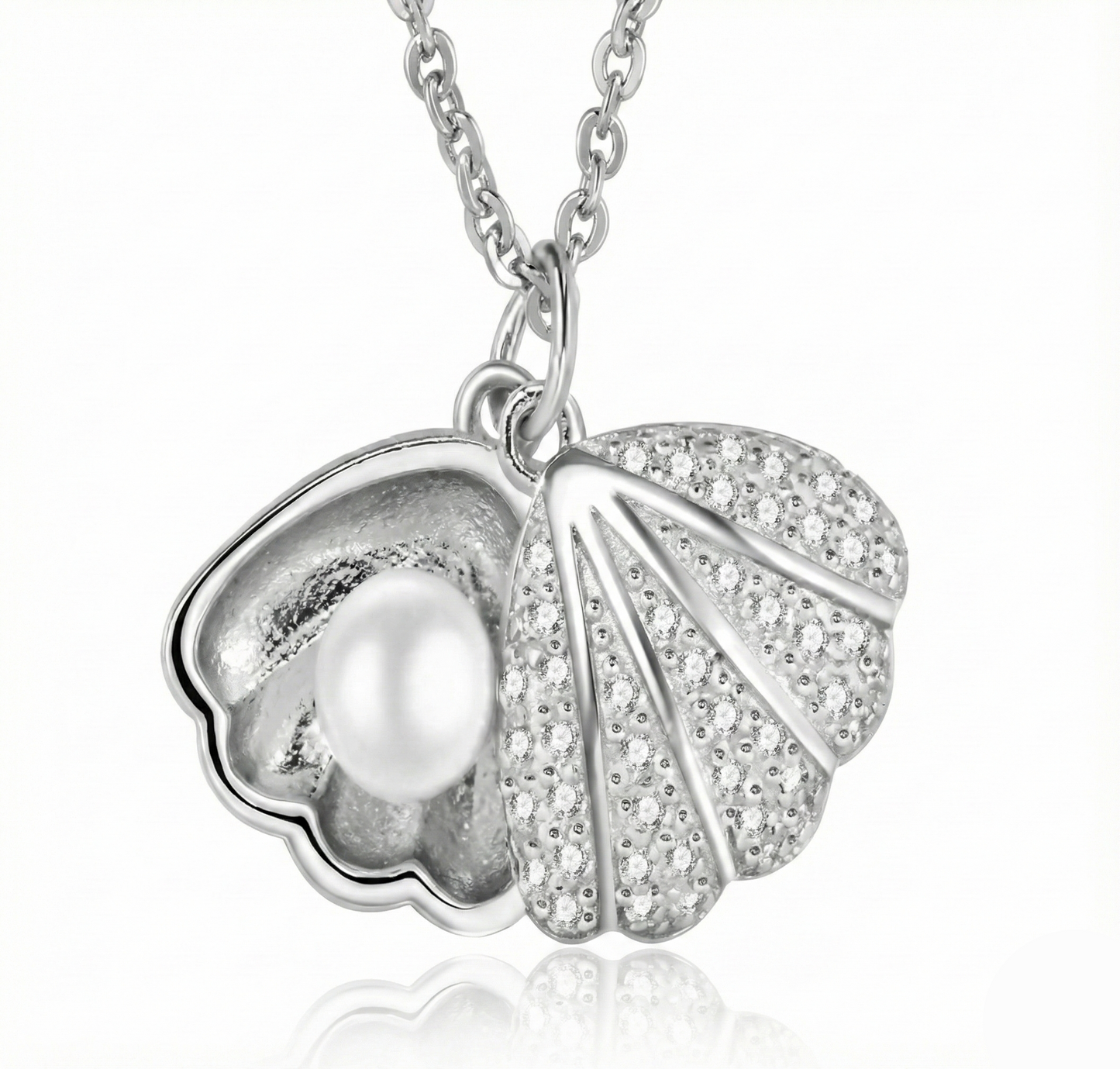 Silver pendant with a pearl and leaf design on a white background