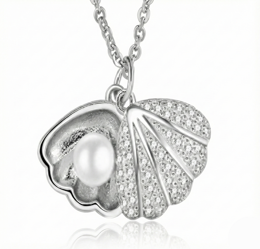 Silver pendant with a pearl and leaf design on a white background