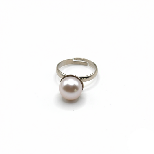 Silver ring with a pearl on a white background