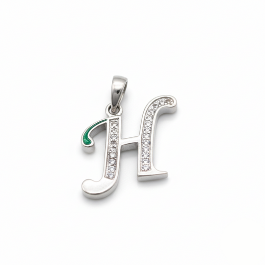 Silver pendant with letter 'H' design on a white background