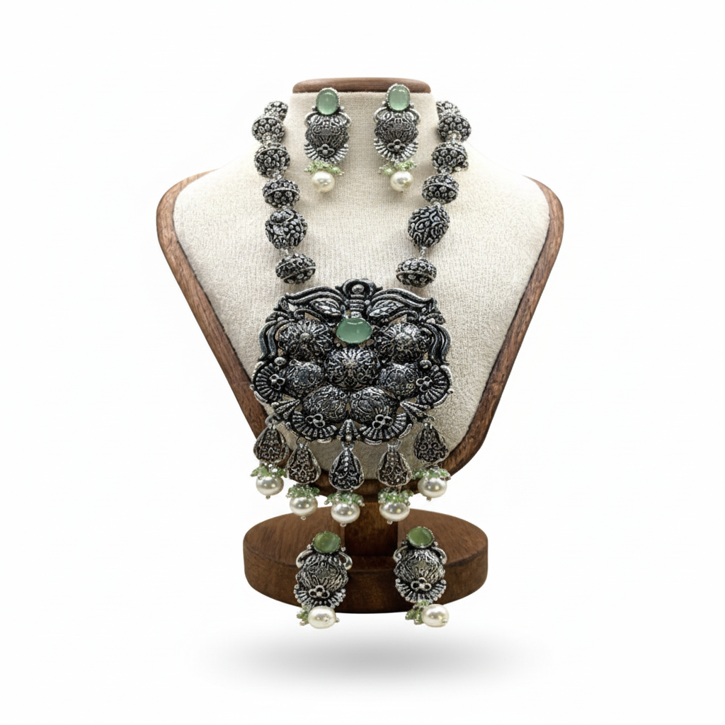 Jewelry set on a wooden stand with a white background