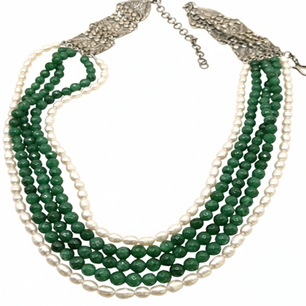 Necklace with green and white beads on a white background