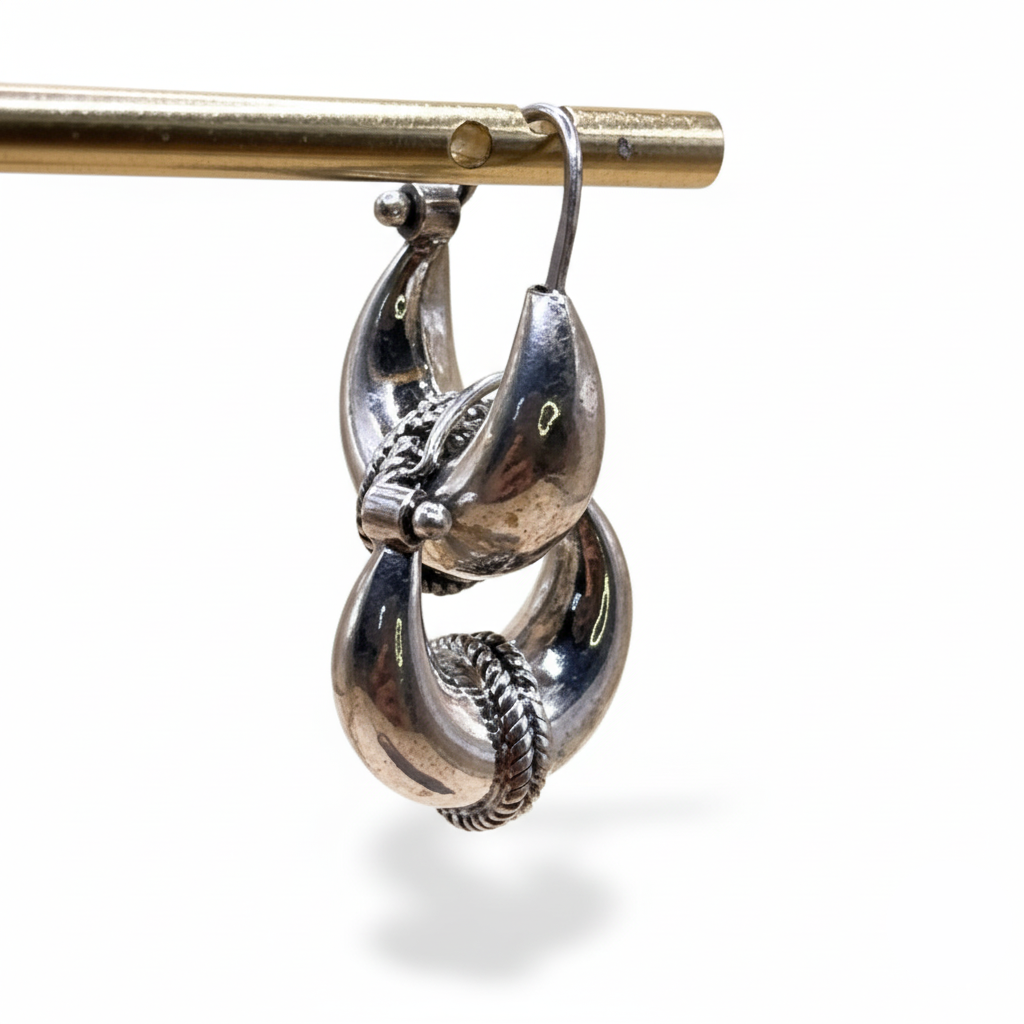 Silver earrings on a white background